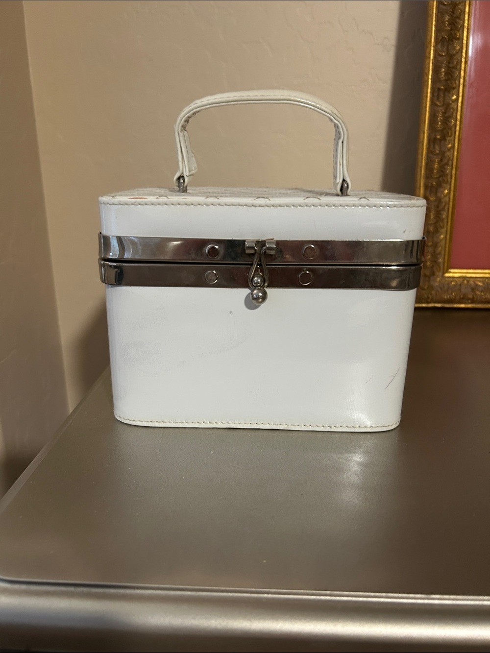 Vintage women’s train case. Would make a cute purse.
